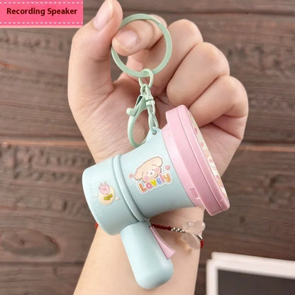 Green and yellow plastic cartoon horn keychain with recording function