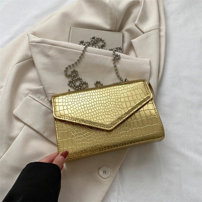 Clamshell handbag with crocodile pattern and soft handle in various colours