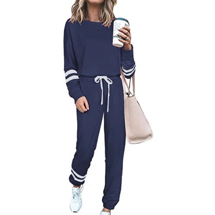 Women's loose-fitting plus size casual suit in a cotton blend, shown in a solid colour with a half-sleeve top and trousers.