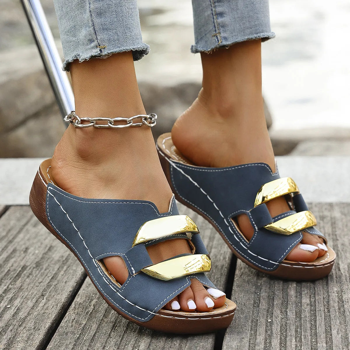 Roman-style platform flip-flop sandals in black, white, khaki, and sea blue on a rubber sole.