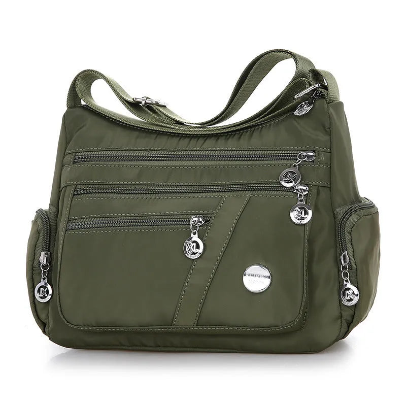 Women's nylon shoulder bag with multi-pocket design, zip opening and detachable handle in red, purple, black or army green