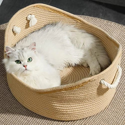 Wicker-style cat bed basket with integrated corrugated cardboard scratching surface, shown in a home setting.