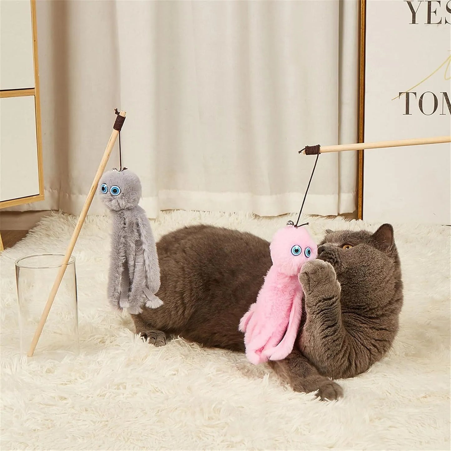 Octopus-themed furry cat toy attached to a long stick, shown in pink colour.