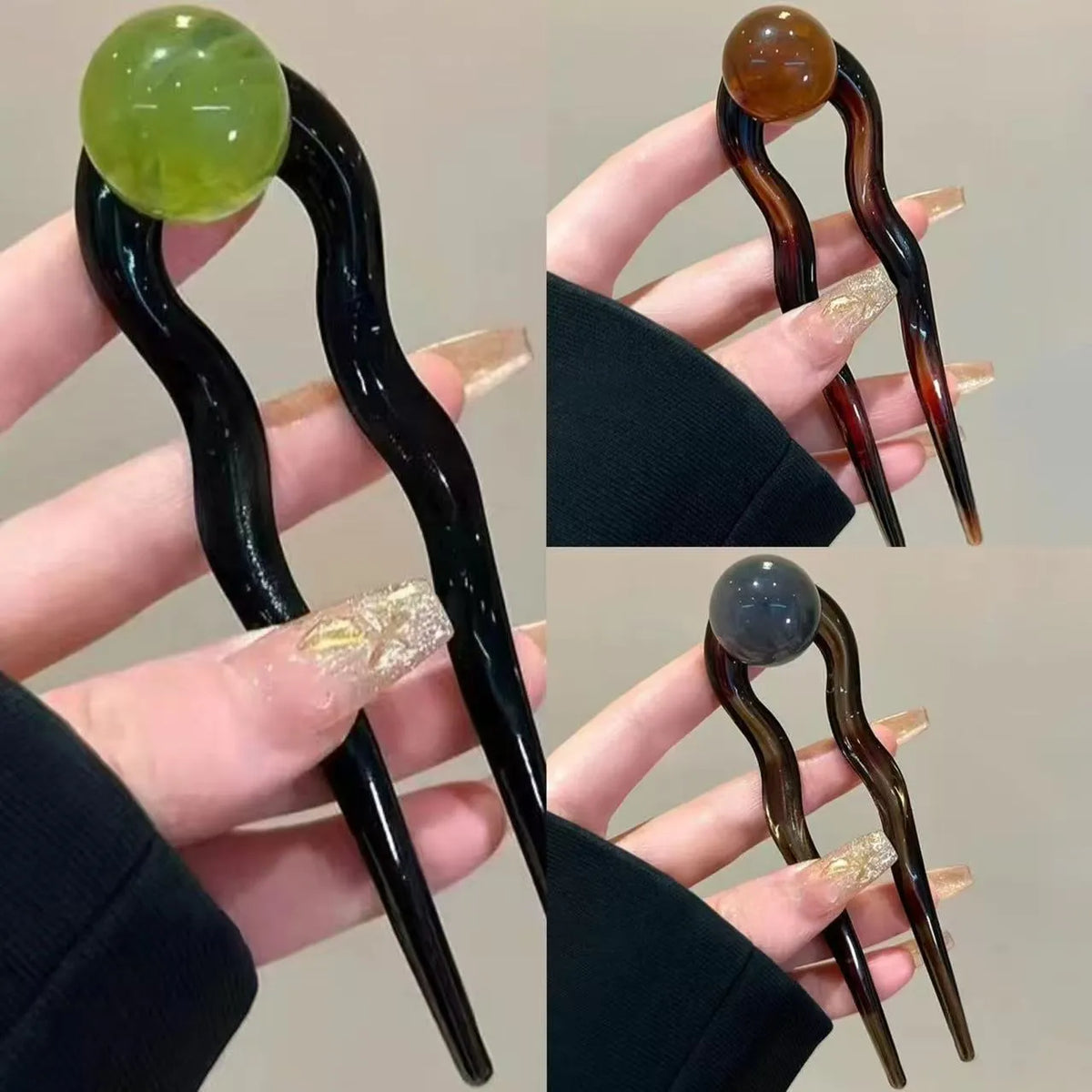 A set of U-shaped acrylic hair barrettes with a simple ball decoration in beige, caramel, and dark grey colours.