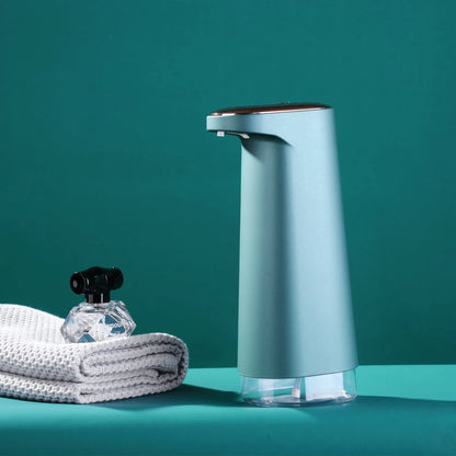 White automatic foam soap dispenser with infrared sensor for touch-free hand washing.