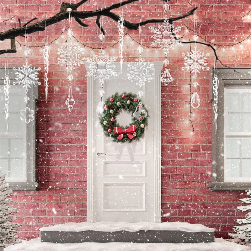 Ten clear acrylic icicle Christmas tree ornaments with hanging holes and white ribbon on pine branches