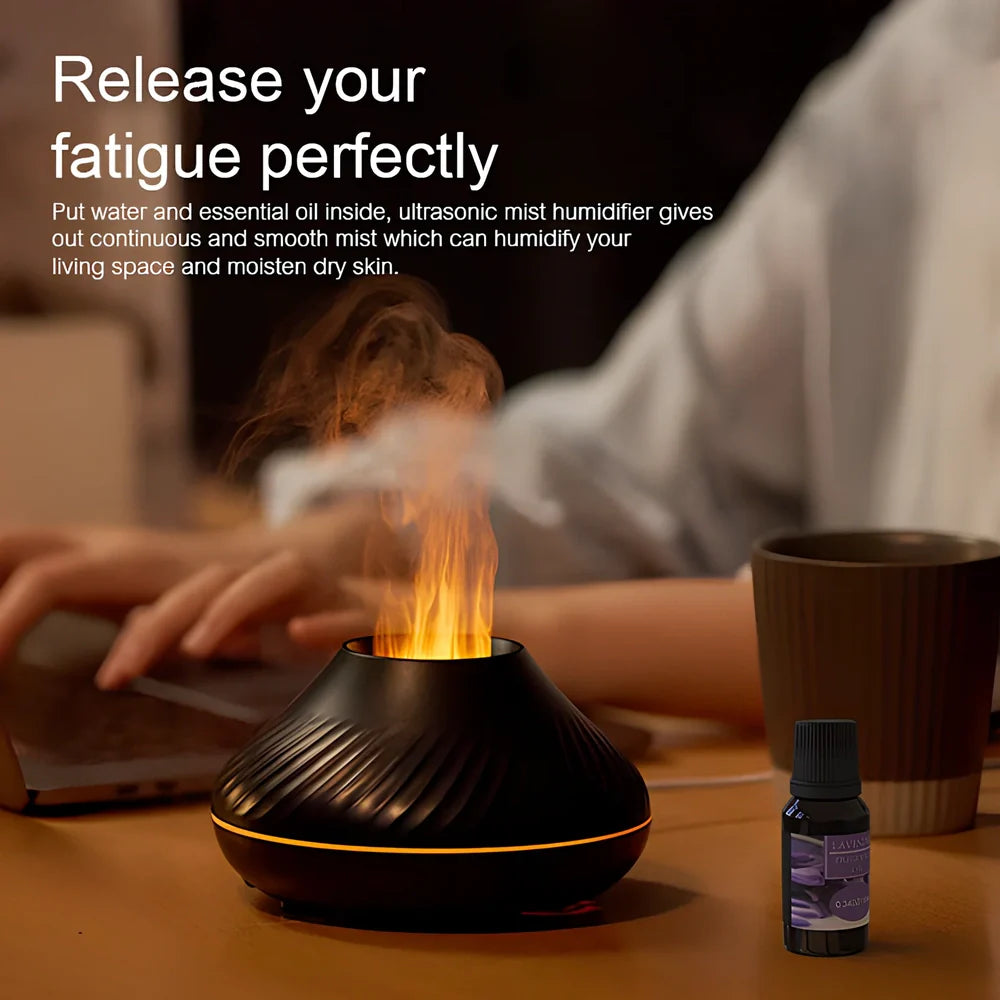 Black RGB flame aroma diffuser 130ml showing 3D colourful volcano mist effect on table