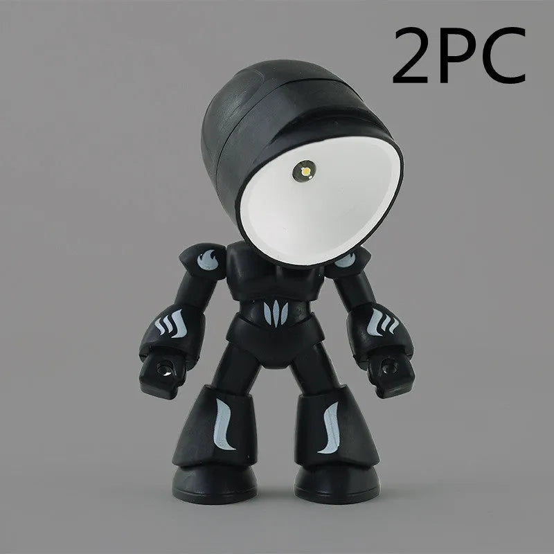 Mini mecha robot hero LED night light with adjustable arms on a desk.