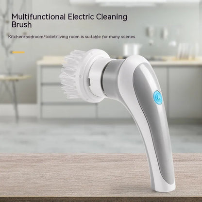 White cordless electric spin scrubber with multiple brush heads on a bathroom tile.