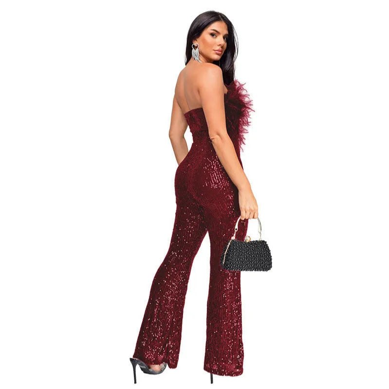 Women's sleeveless backless jumpsuit with flared legs in a wine red colour.