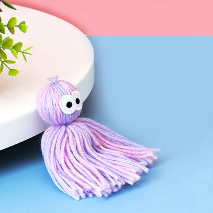 Felted natural wool cat toy ball in blue-grey colours, shown next to a measuring tape indicating 10cm width.