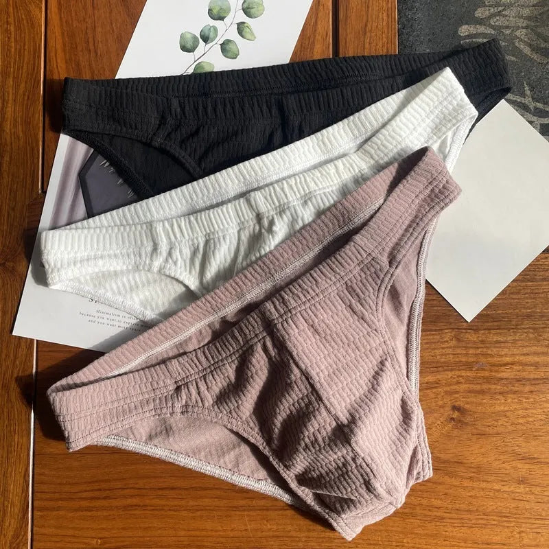Men's solid colour pure cotton triangle underwear briefs on a mid-waist fit model