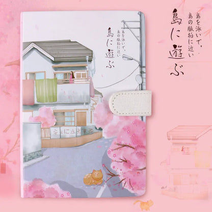 A5 wire-bound retro style notebook with colourful illustrated cover, shown with included pen.