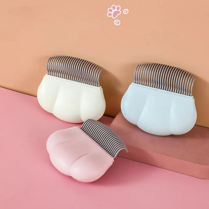 Paw Soft deshedding brush in blue, pink, or white with a 9cm square head of stainless steel pins.