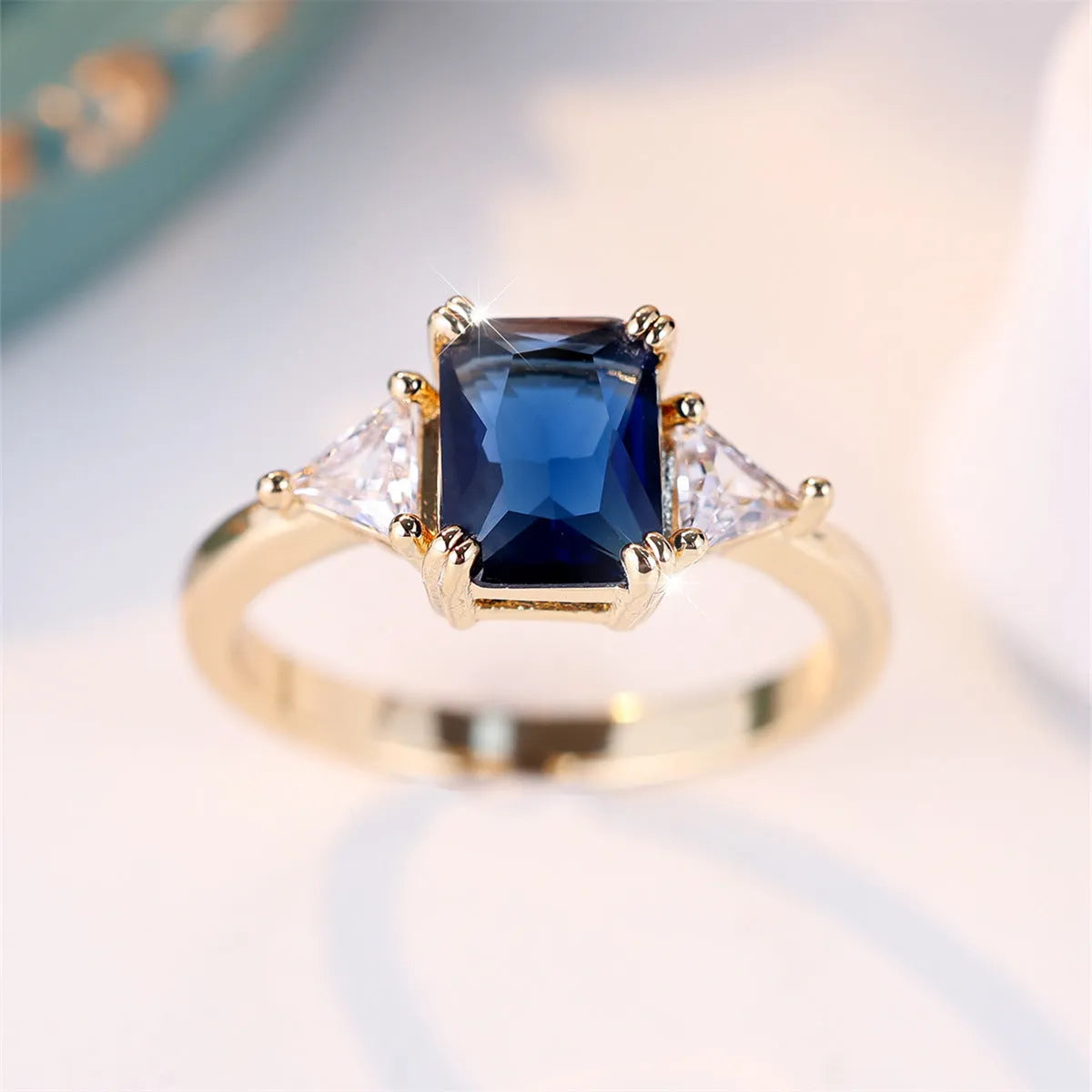 Rectangular women's fashion ring in gold sapphire blue copper with geometric design