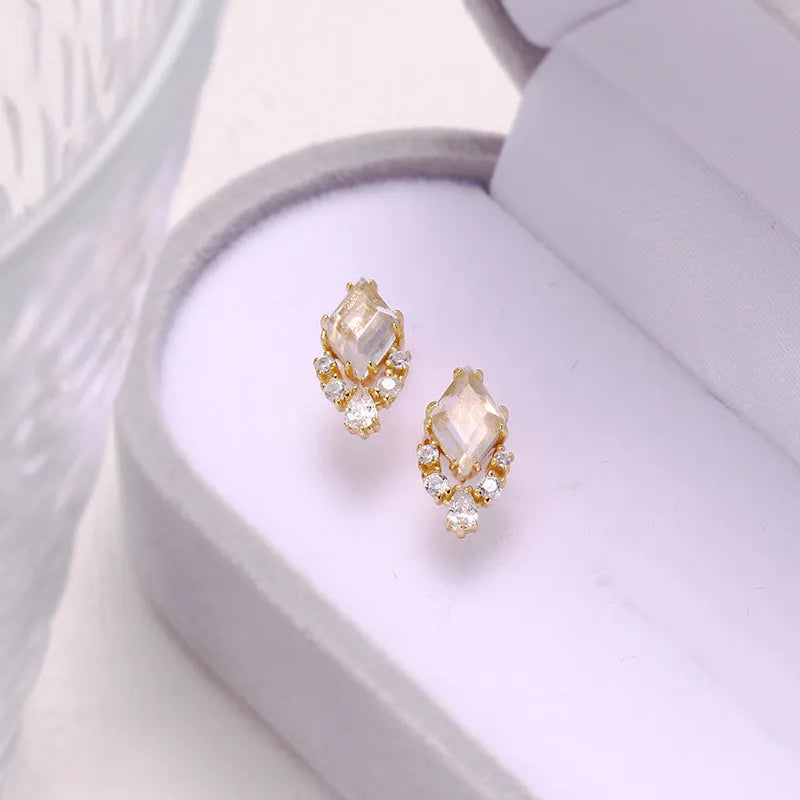 Geometric sterling silver ear studs with sweet white crystal stones