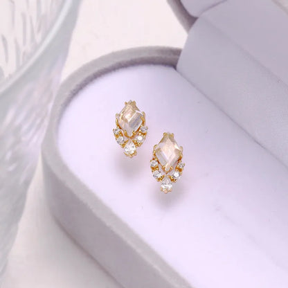 Geometric sterling silver ear studs with sweet white crystal stones