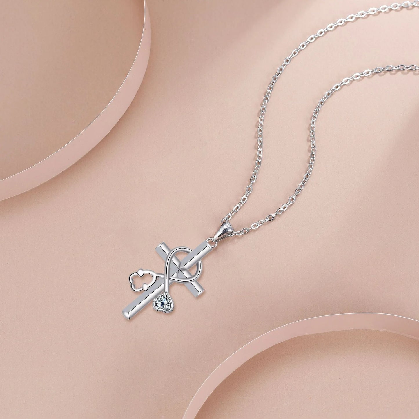 Medical-themed cross necklace with stethoscope pendant on copper chain