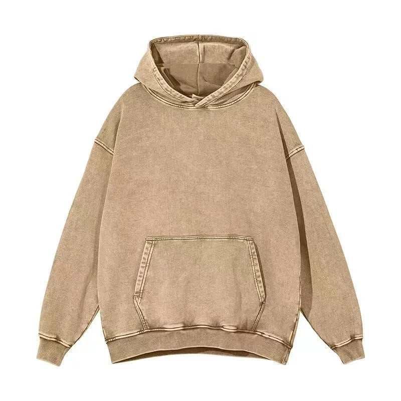 Man wearing a loose, collarless cotton hoodie with a batik-washed texture in a brown colour.