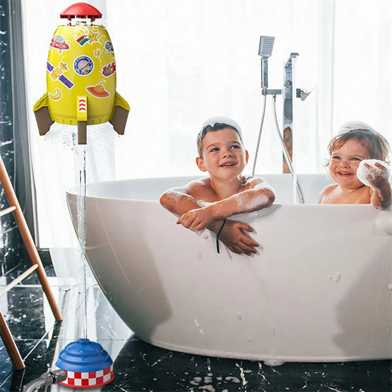 Yellow outdoor water pressure rocket launcher toy for kids on a green lawn.