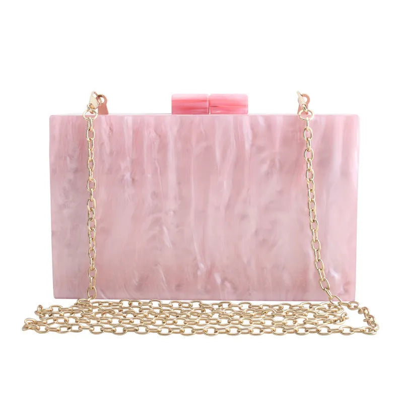 Small square acrylic clutch bag with long chain, marble pattern, and internal phone pocket