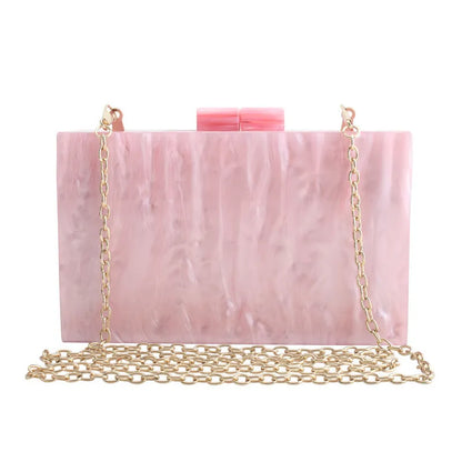 Small square acrylic clutch bag with long chain, marble pattern, and internal phone pocket