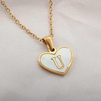 Gold-plated heart necklace with white shell pendant showing letter personalisation option