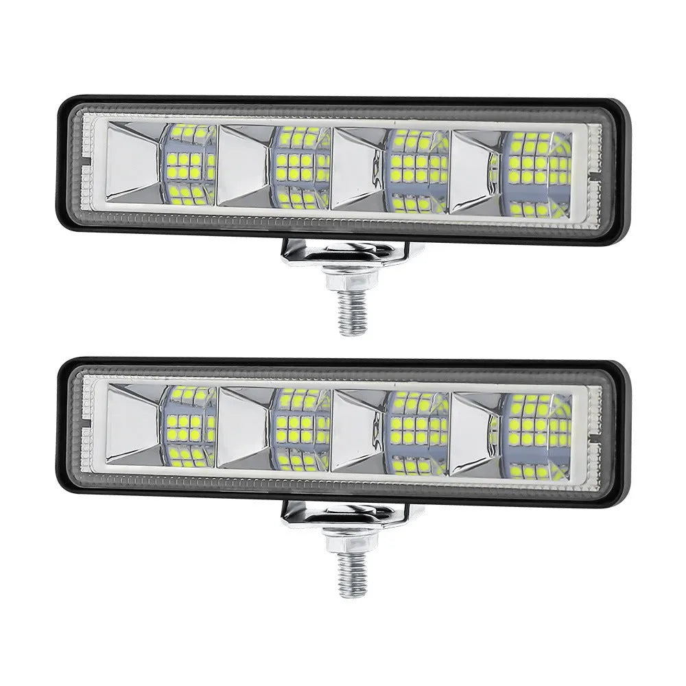 Four compact aluminium LED work lights in work light white colour, suitable for vehicle mounting.
