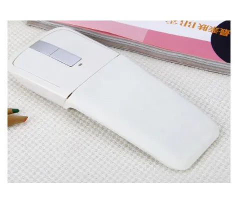 Folding wireless touch mouse showing compact design with Bluetooth connectivity