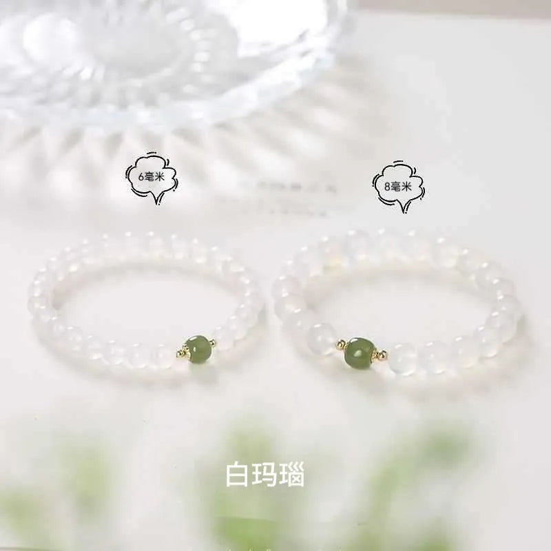 Handmade white agate and crystal bracelet with cinnabar inlay, showing 6mm or 8mm bead options.