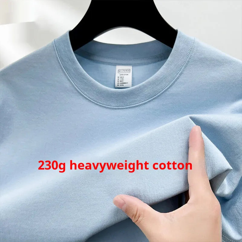 Men's thin cotton drop shoulder t-shirt on a hanger, shown in a light colour.