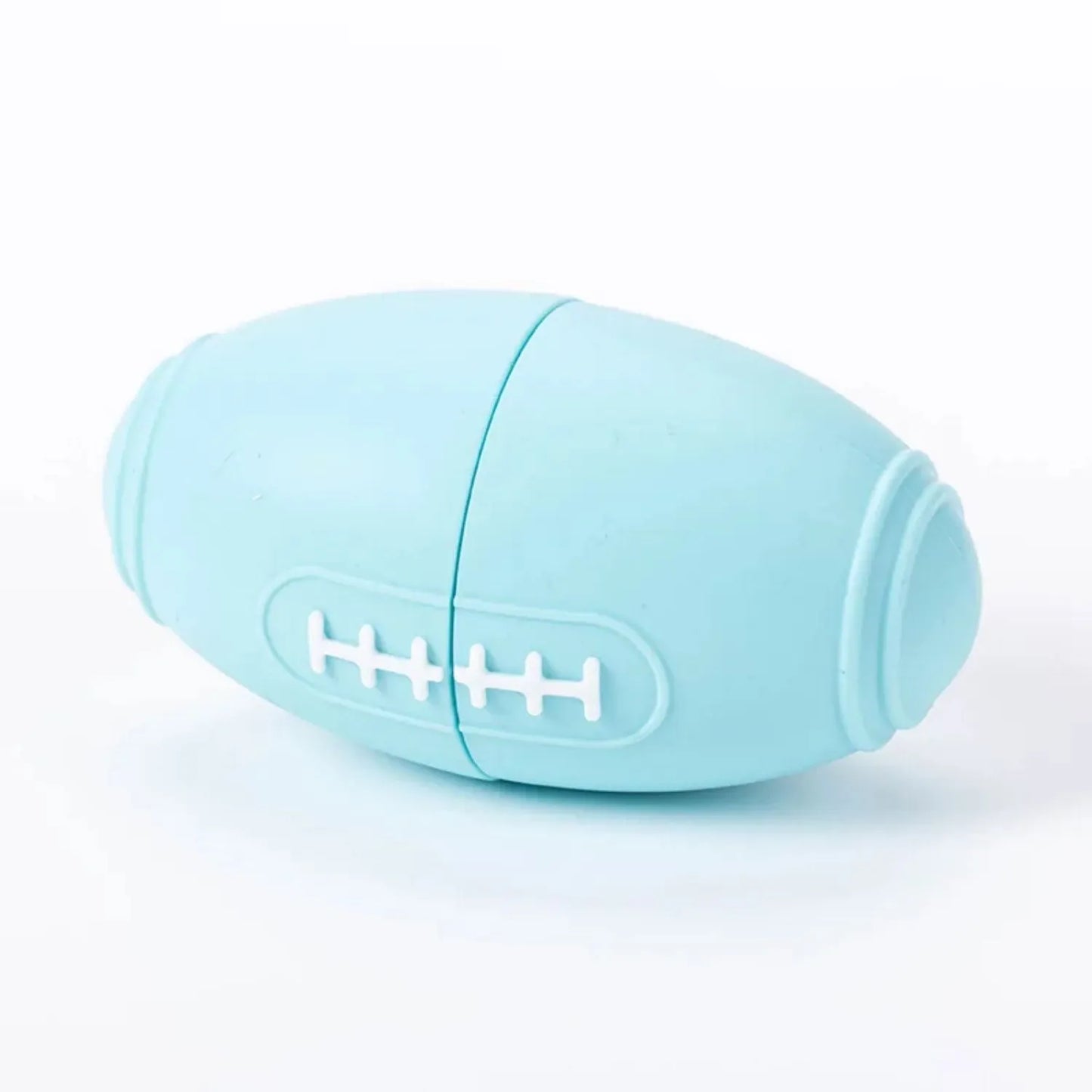 Blue silicone rugby ball dog toy with ridges and hollow centre for treats