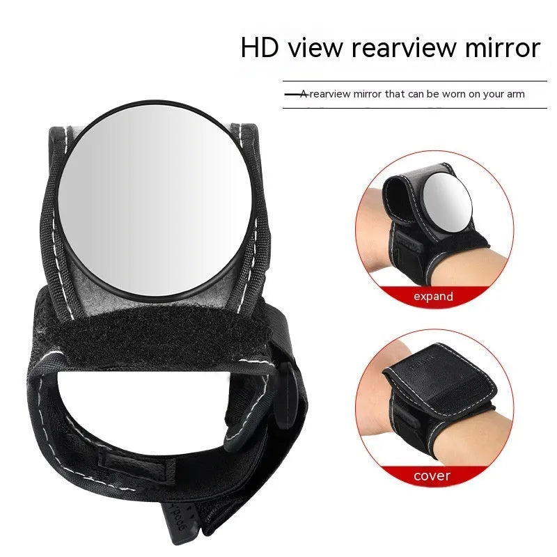 Black nylon bicycle rear-view mirror mounted on a cyclist's wrist.