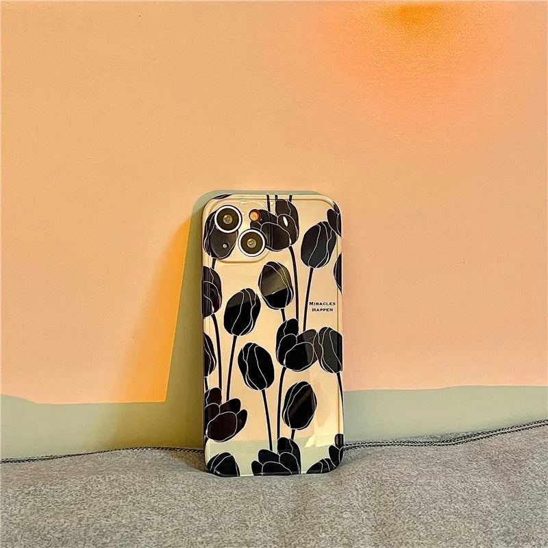 Cold Wind Black Tulip phone case, a silicone back cover with tulip floral patterns for iPhone 13, 12, 11, X/XS, XR, XS Max, and 7 Plus / 8 Plus models, in a black and tulip design