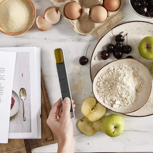 Adjustable 12-speed measuring spoon in grey, perfect for precise kitchen measurements