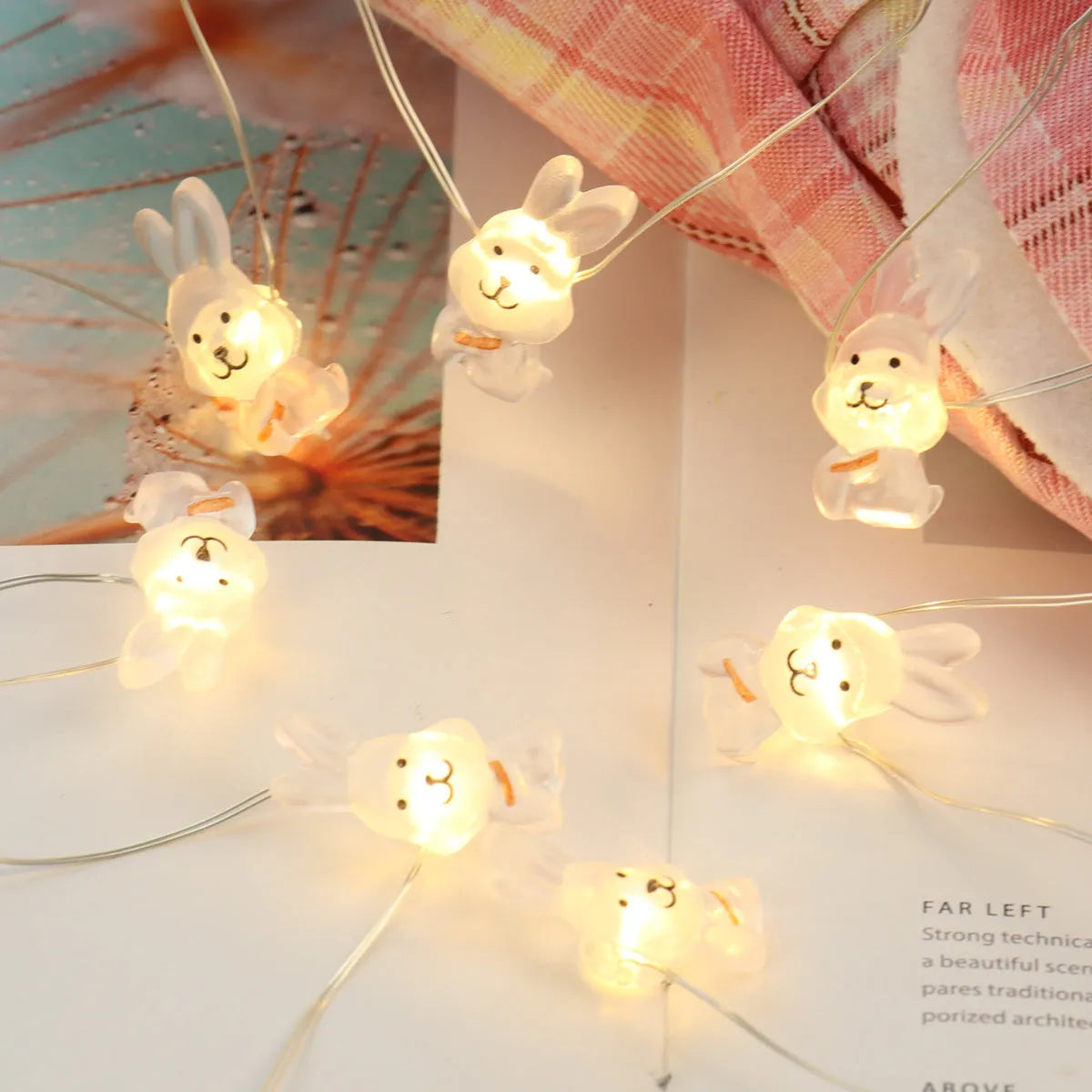 Easter LED bunny string lights with carrot and transparent white rabbit shapes on flexible copper wire