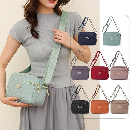 Compact nylon messenger bag for women in various colours with adjustable strap
