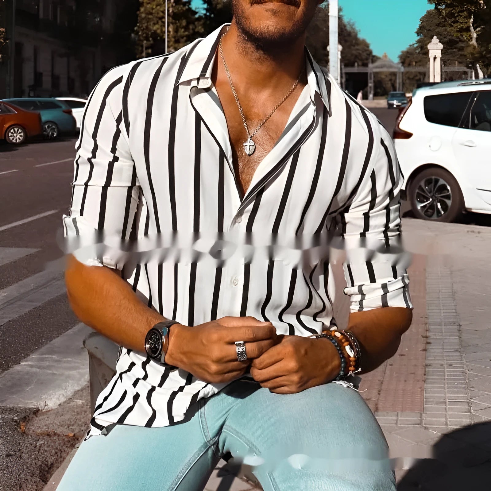 Man modelling a khaki and white striped loose-fit long sleeve casual button shirt.