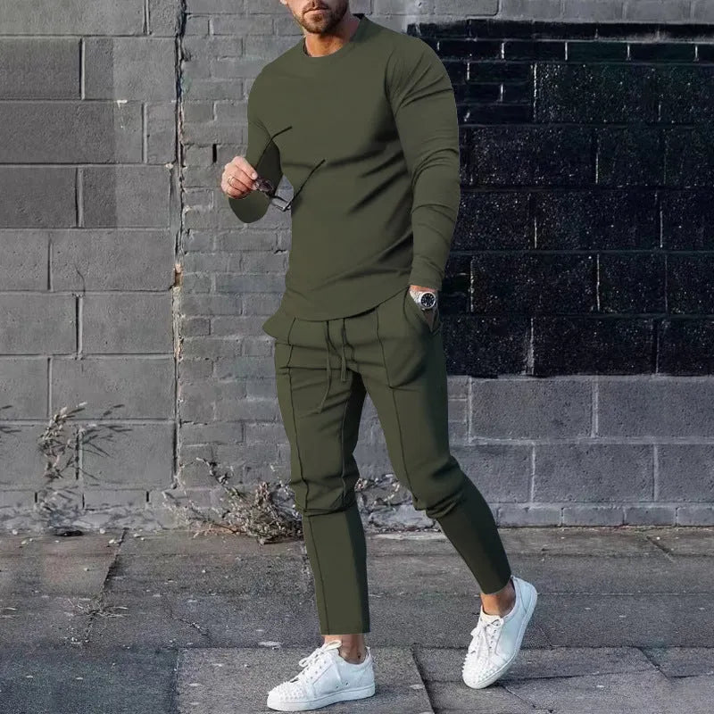 Men's solid colour two-piece lounge suit with long sleeve T-shirt and trousers in light grey.