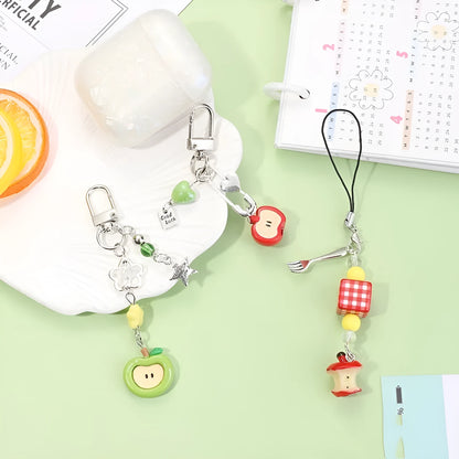 Plastic and resin fruit charm keychain with apple, strawberry designs on silver rope