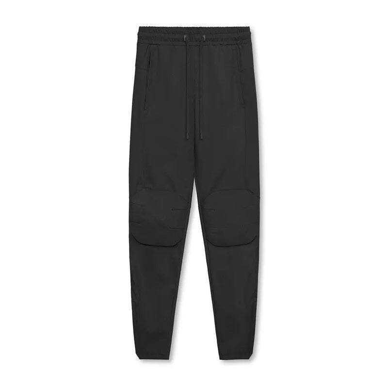 Men's grey fitness trousers with ankle ties, made from 100% polyester for quick-drying during exercise