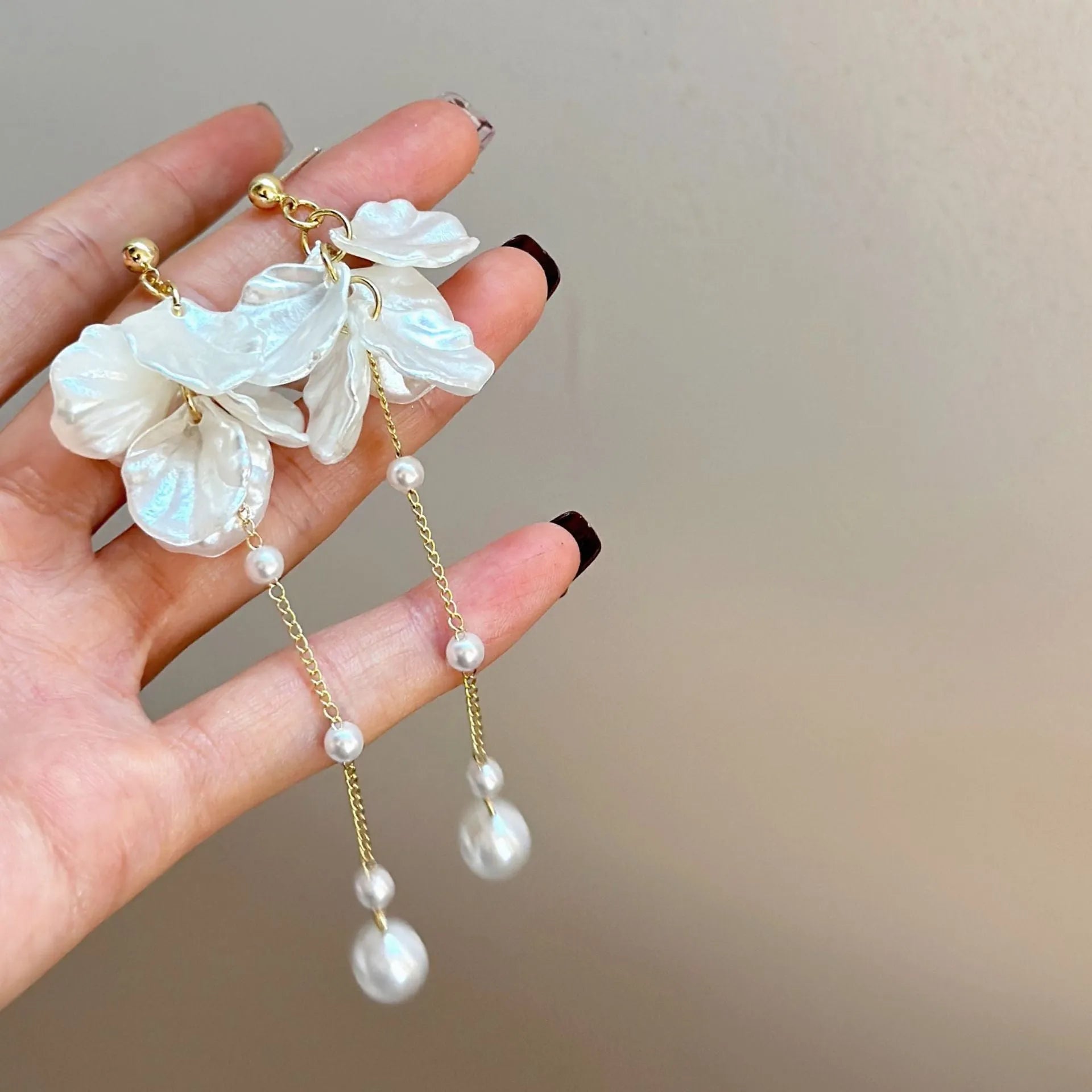 Women's acrylic shell pearl tassel earrings showing four ear clip types and casual style design