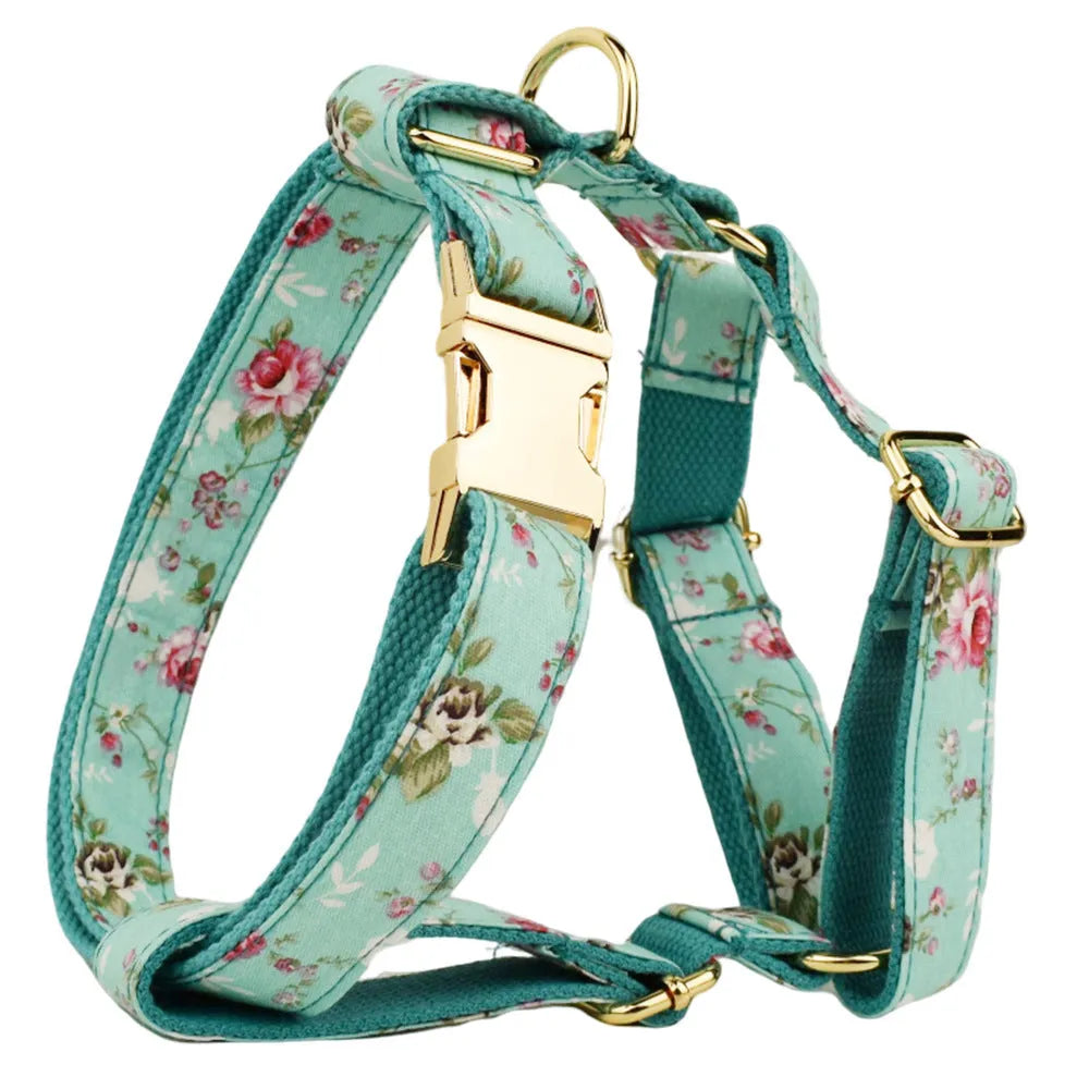 Rose and green cloth dog collar set with detachable bow, matching leash, and vest