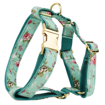 Rose and green cloth dog collar set with detachable bow, matching leash, and vest