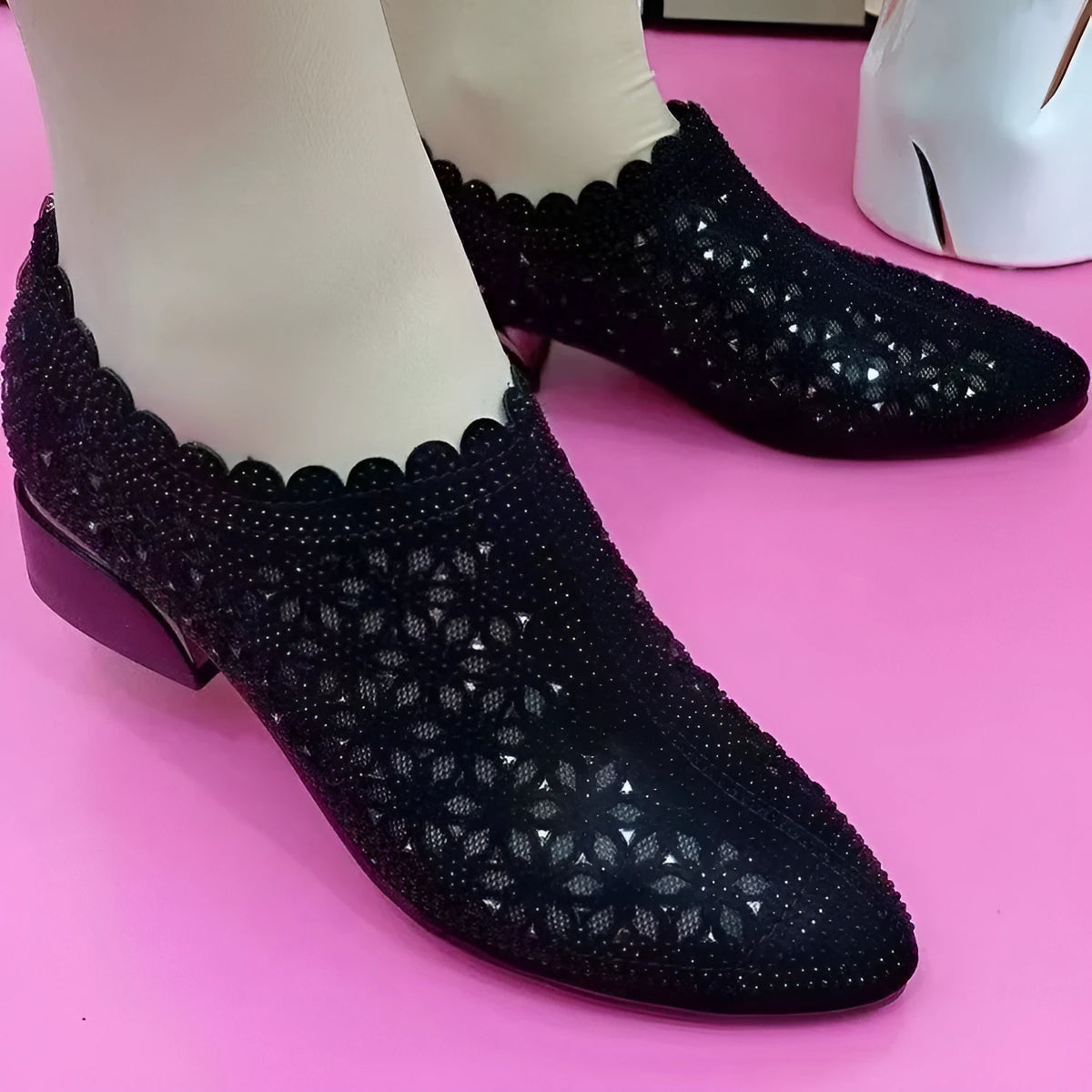 Women's chunky heel shoes with hollow-out upper, frosted full diamond detailing, round toe, canvas upper, and rubber sole.