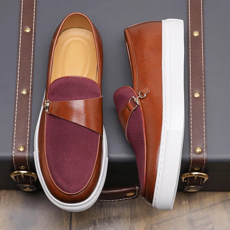Men's black slip-on shoes with a gold horsebit buckle detail and round toe.