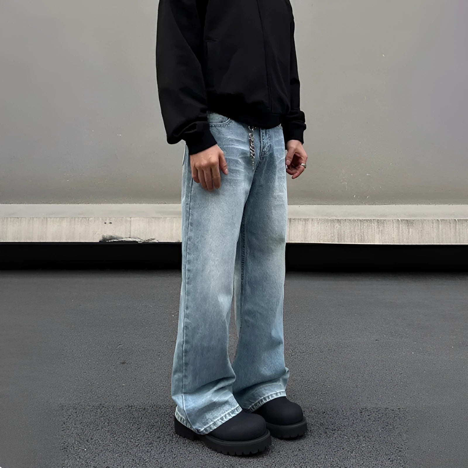 Men's blue straight leg jeans with whisker distressing and flared leg cut