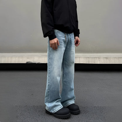 Men's blue straight leg jeans with whisker distressing and flared leg cut