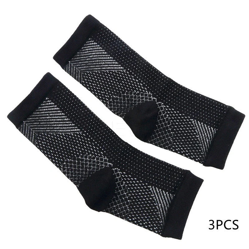Anti-fatigue compression foot sleeve in black, red, or white, featuring moisture-wicking fabric and a heel hole for breathability.
