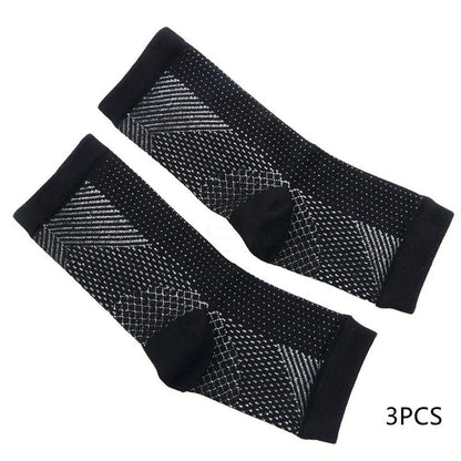 Anti-fatigue compression foot sleeve in black, red, or white, featuring moisture-wicking fabric and a heel hole for breathability.